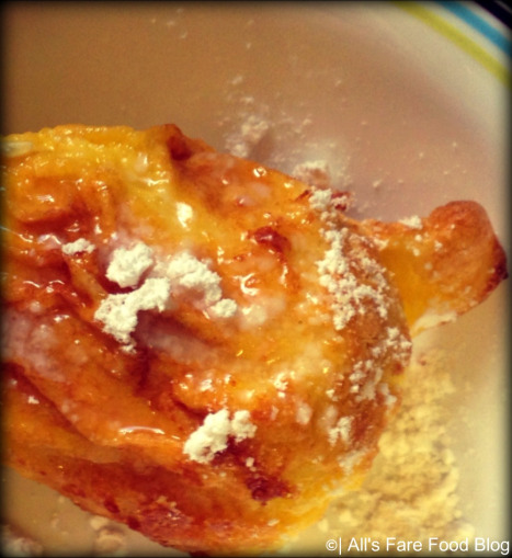 Sprinkle german pancake with powdered sugar and lemon juice